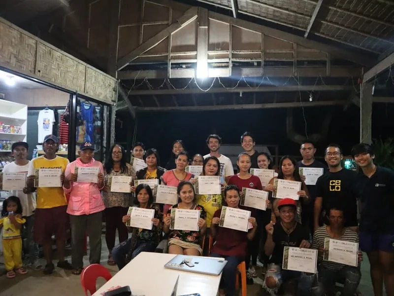 Certificate ceremony with community members in the Philippines